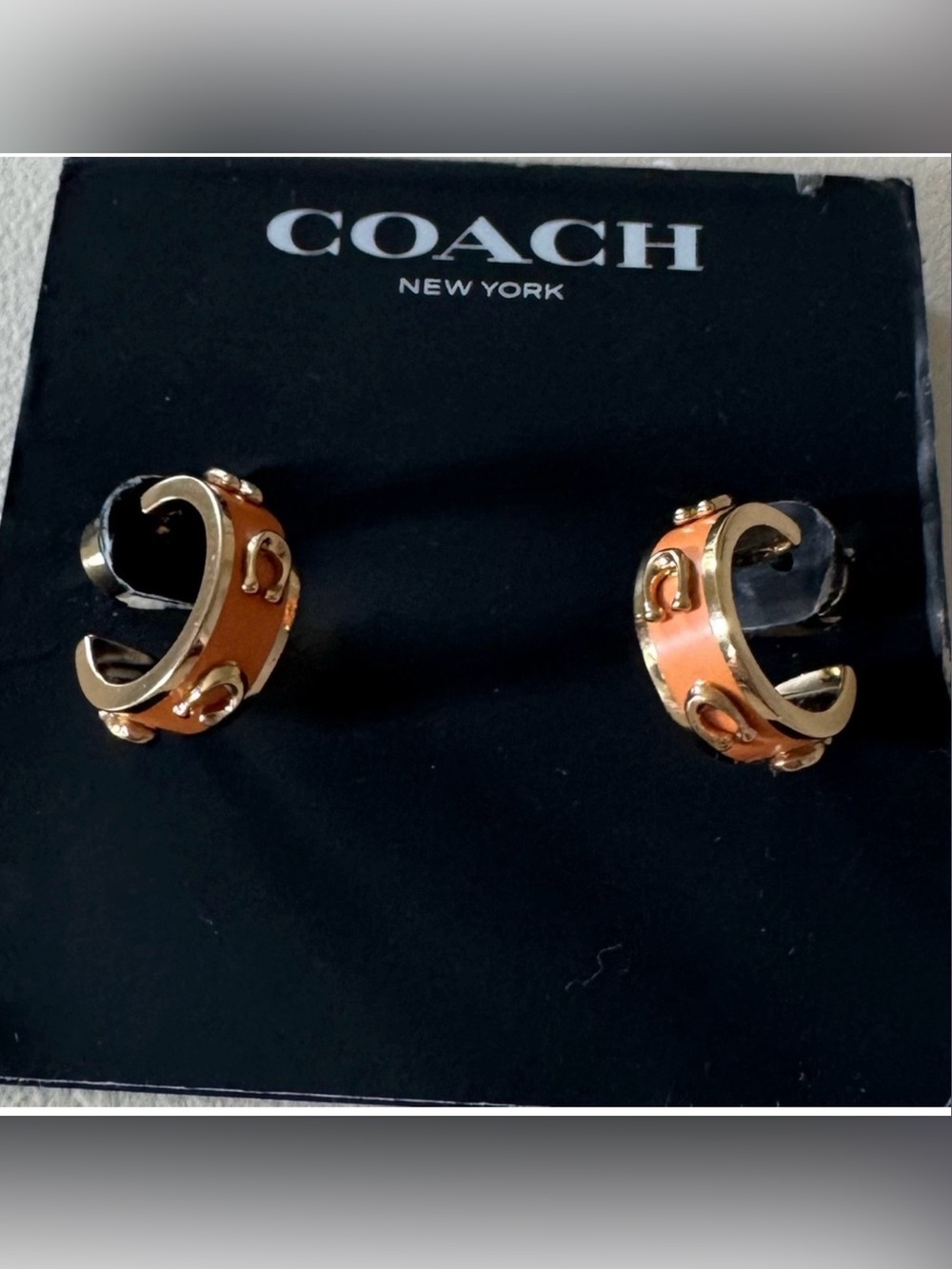 Brand new”COACH”earrings.Very nice,color orange/gold.💛